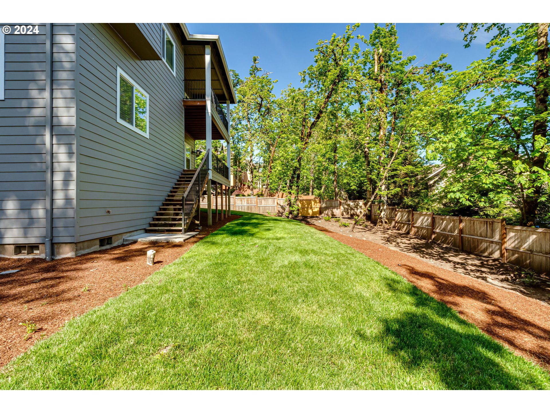 6362 Forest Ridge Drive Springfield, OR 97478 - Photo 43 of 44 a view of a backyard with a tree