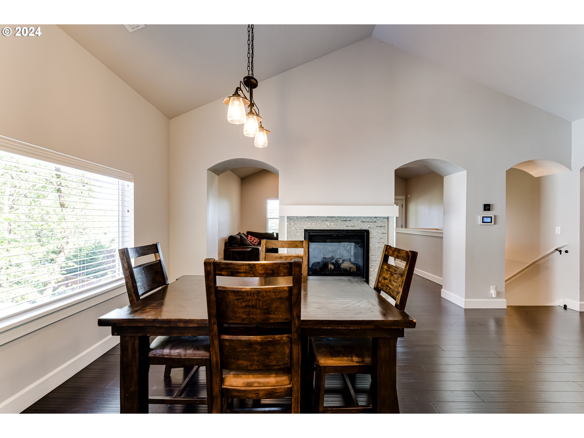 6362 Forest Ridge Drive Springfield, OR 97478 - Photo 7 of 44 a living room with furniture a fireplace and a large window