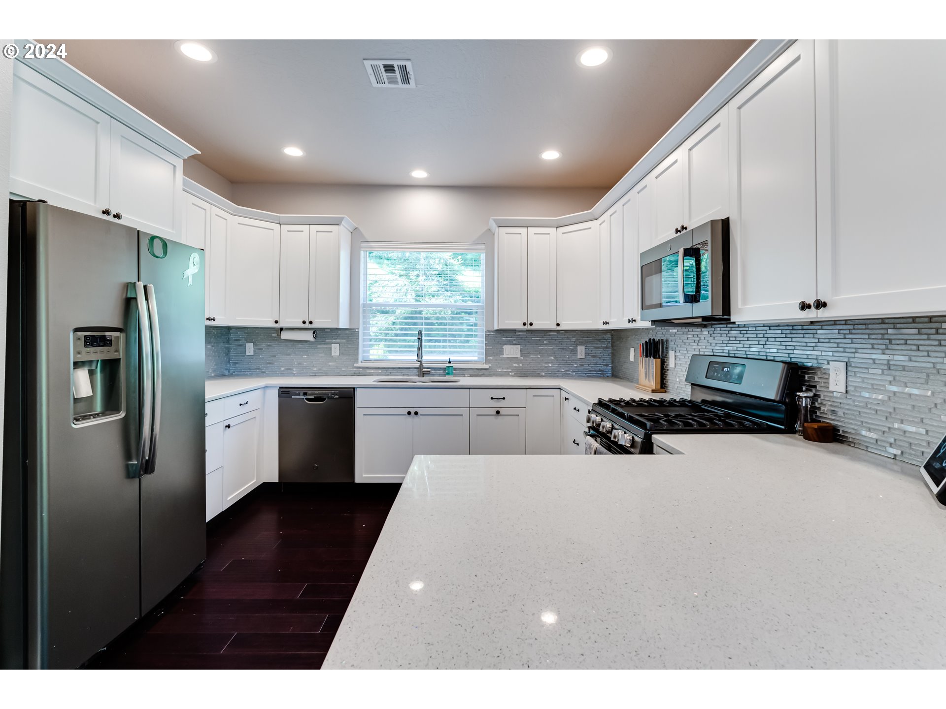 6362 Forest Ridge Drive Springfield, OR 97478 - Photo 8 of 44 a kitchen with stainless steel appliances a refrigerator sink and cabinets