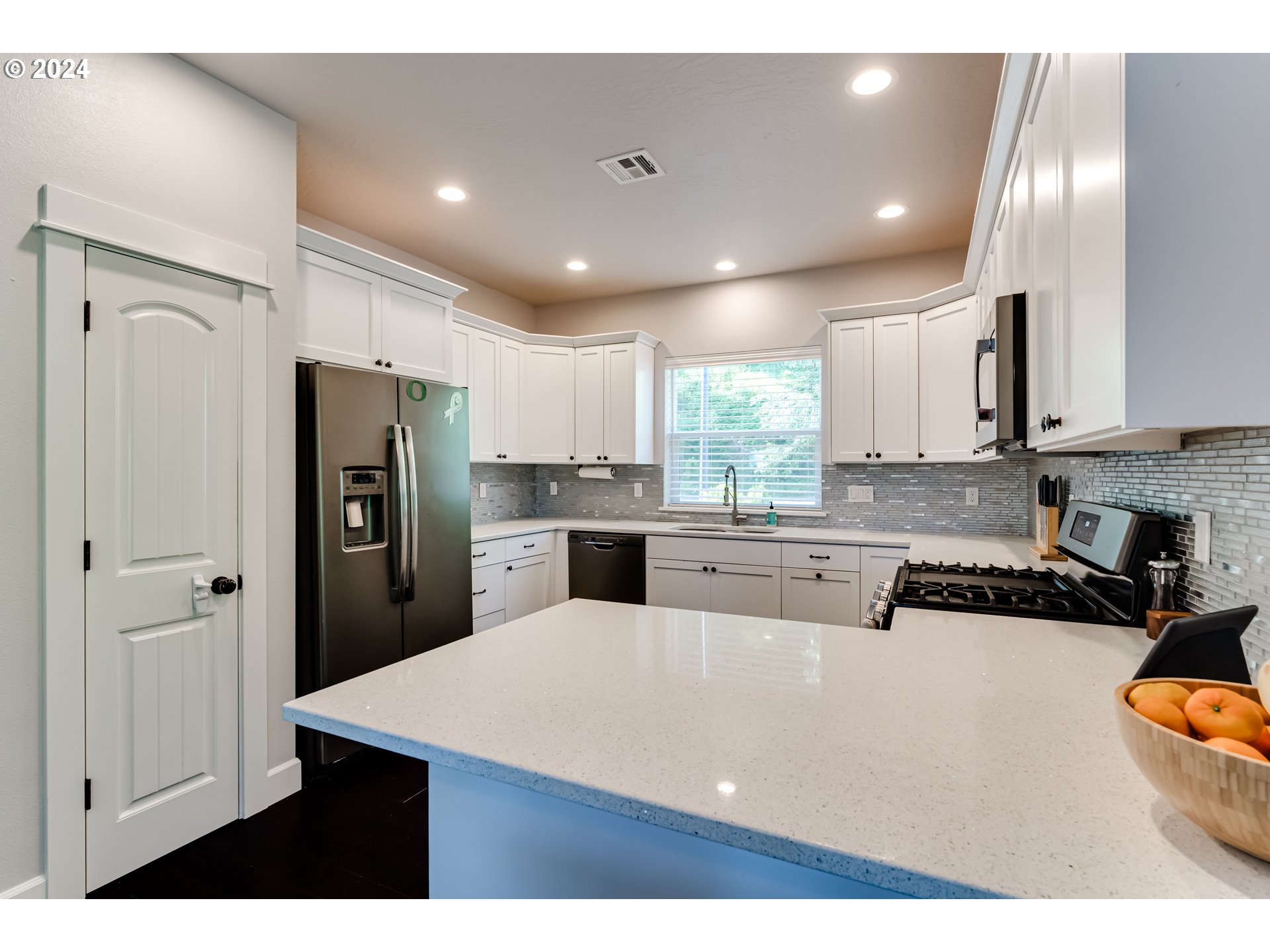 6362 Forest Ridge Drive Springfield, OR 97478 - Photo 9 of 44 a kitchen with stainless steel appliances granite countertop a refrigerator sink and cabinets