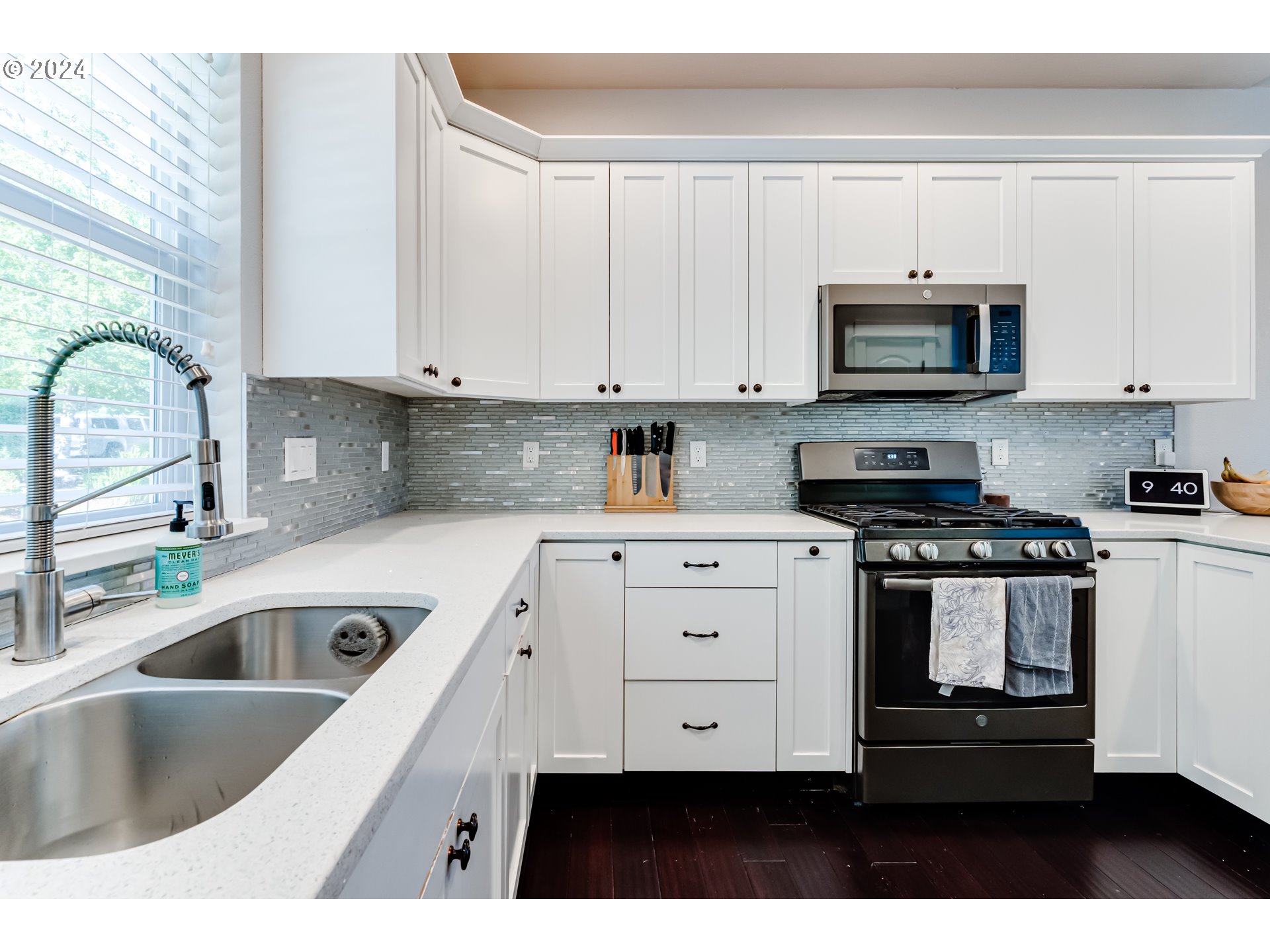 6362 Forest Ridge Drive Springfield, OR 97478 - Photo 10 of 44 a kitchen with stainless steel appliances granite countertop a sink a stove and cabinets