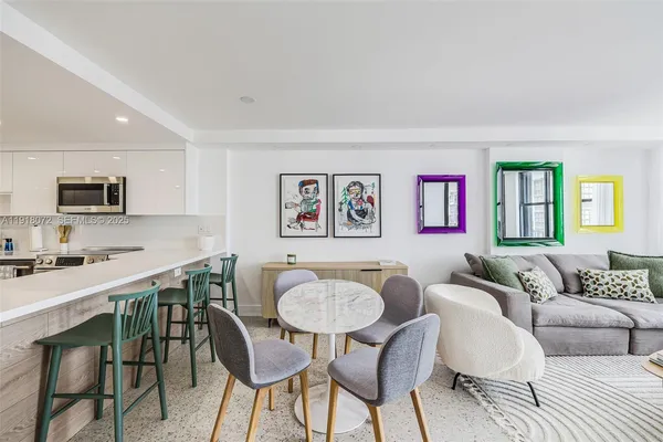 a view of a livingroom with furniture and a wooden floor