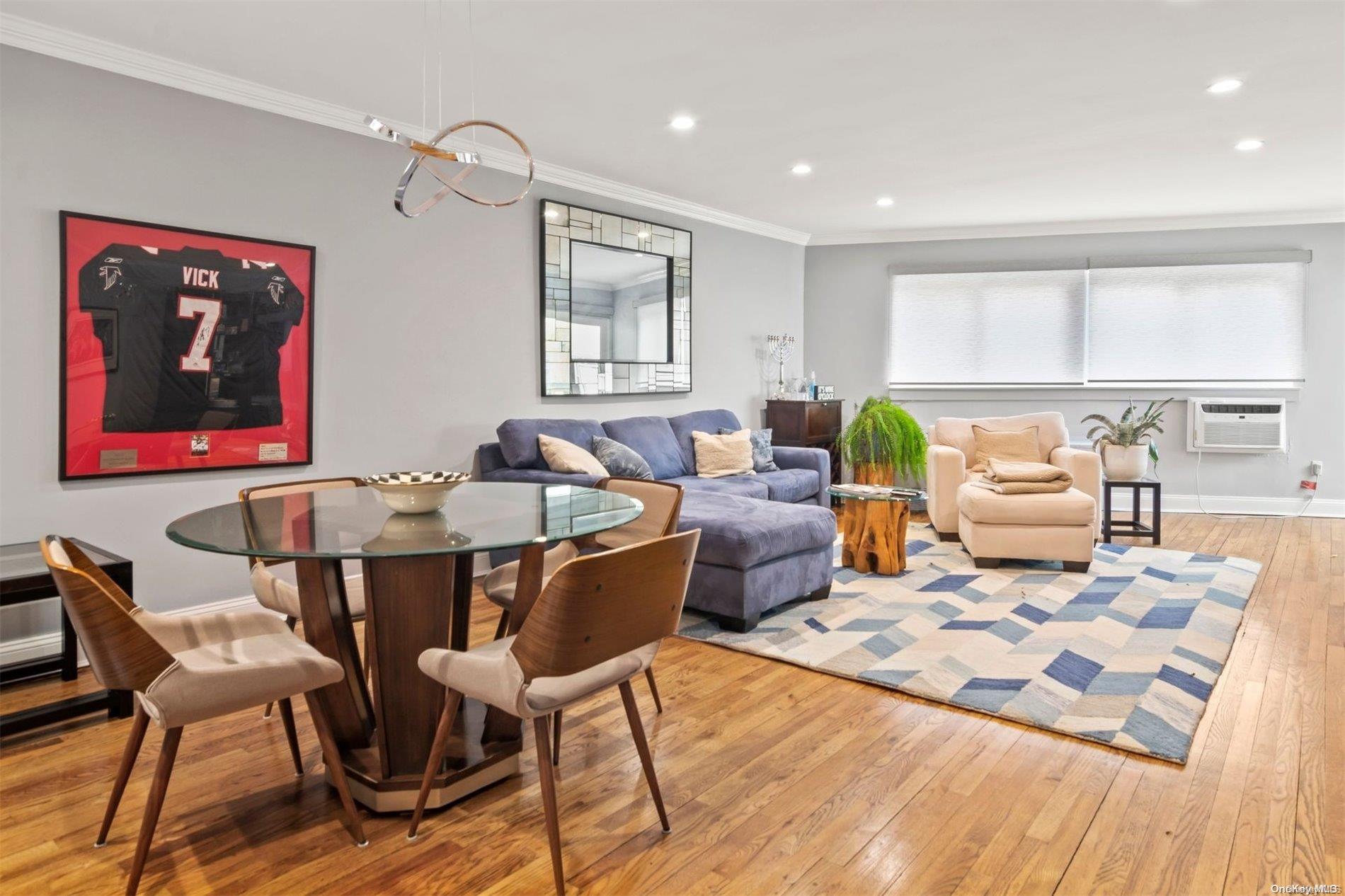 600 Shore Road, Unit 6A Long Beach, NY 11561 - Photo 1 of 1 a living room with furniture and wooden floor