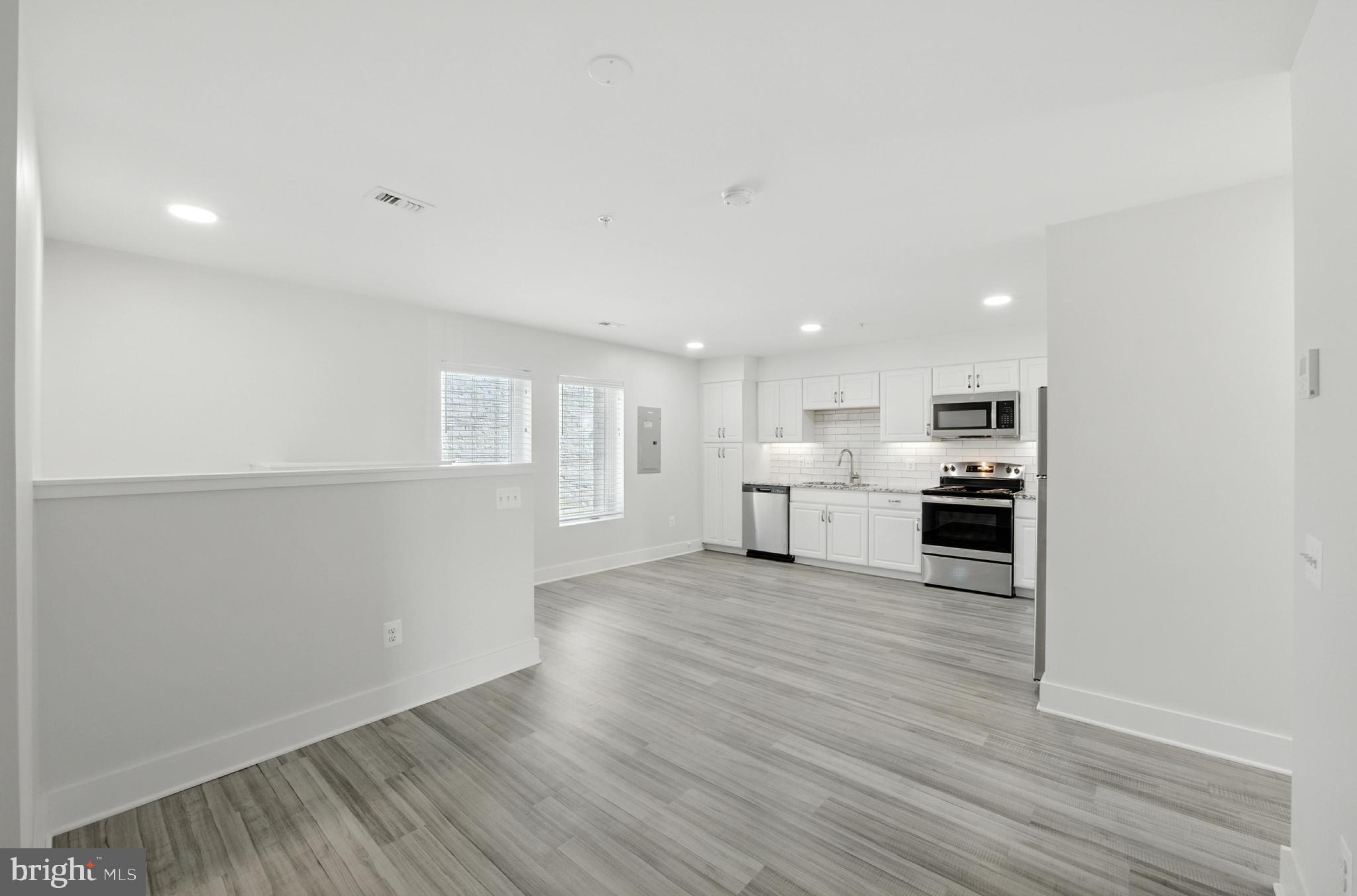 19510 Village Walk, Unit 2205 Montgomery Village, MD 20886 - Photo 11 of 21 a view of kitchen with wooden floor