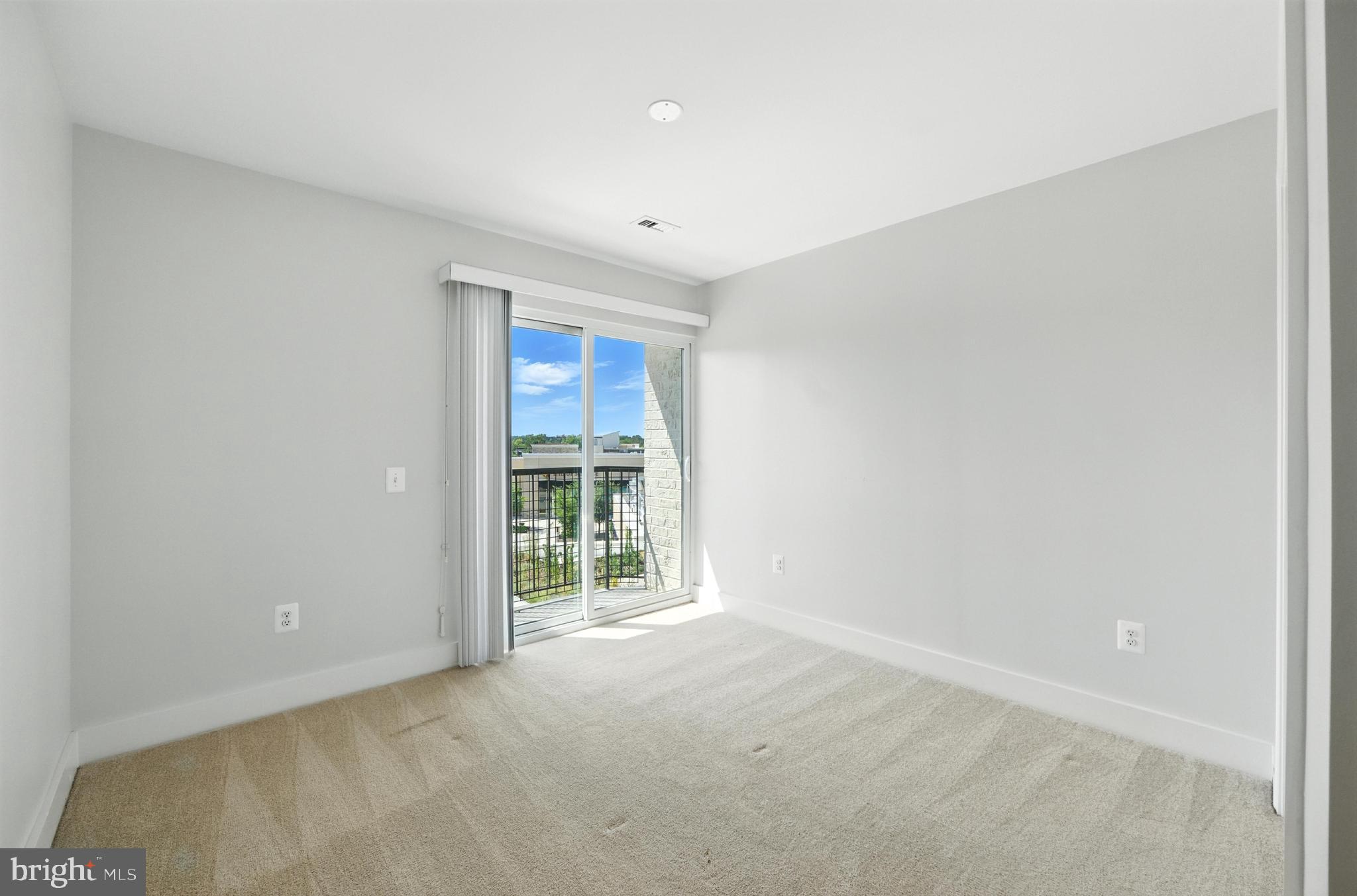19510 Village Walk, Unit 2205 Montgomery Village, MD 20886 - Photo 16 of 21 an empty room with windows