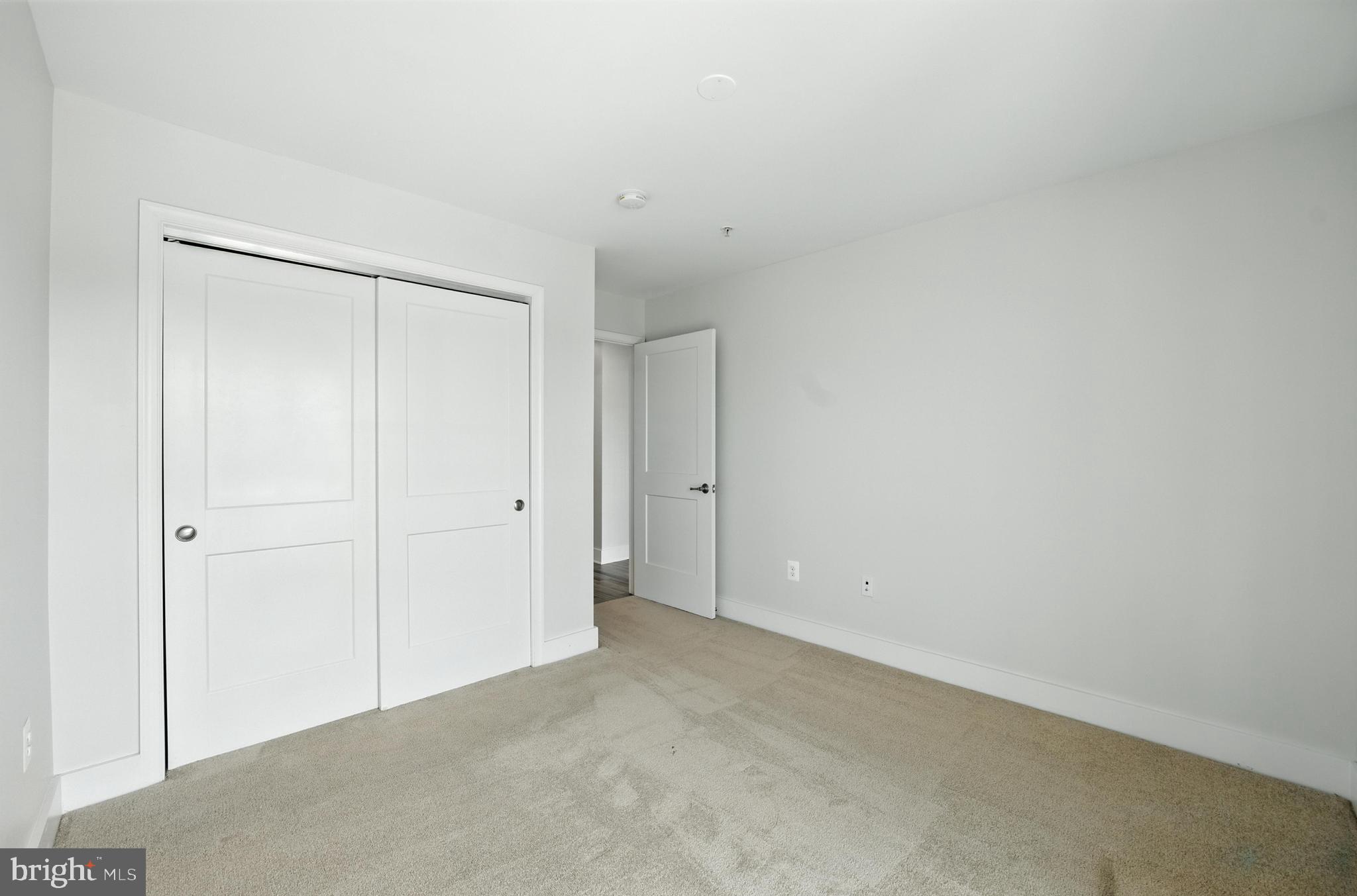 19510 Village Walk, Unit 2205 Montgomery Village, MD 20886 - Photo 18 of 21 a view of an empty room