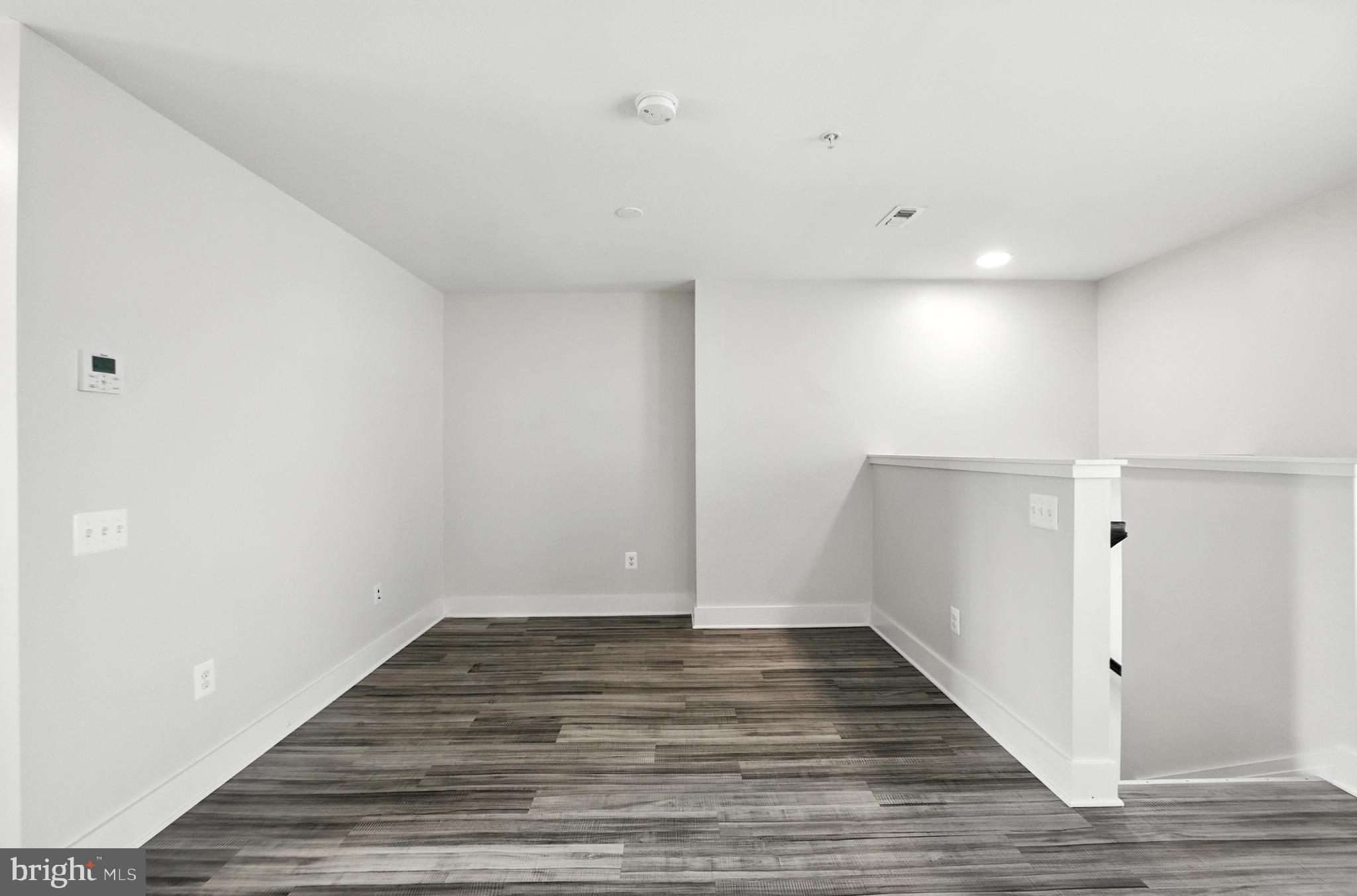 19510 Village Walk, Unit 2205 Montgomery Village, MD 20886 - Photo 9 of 21 a view of room with wooden floor