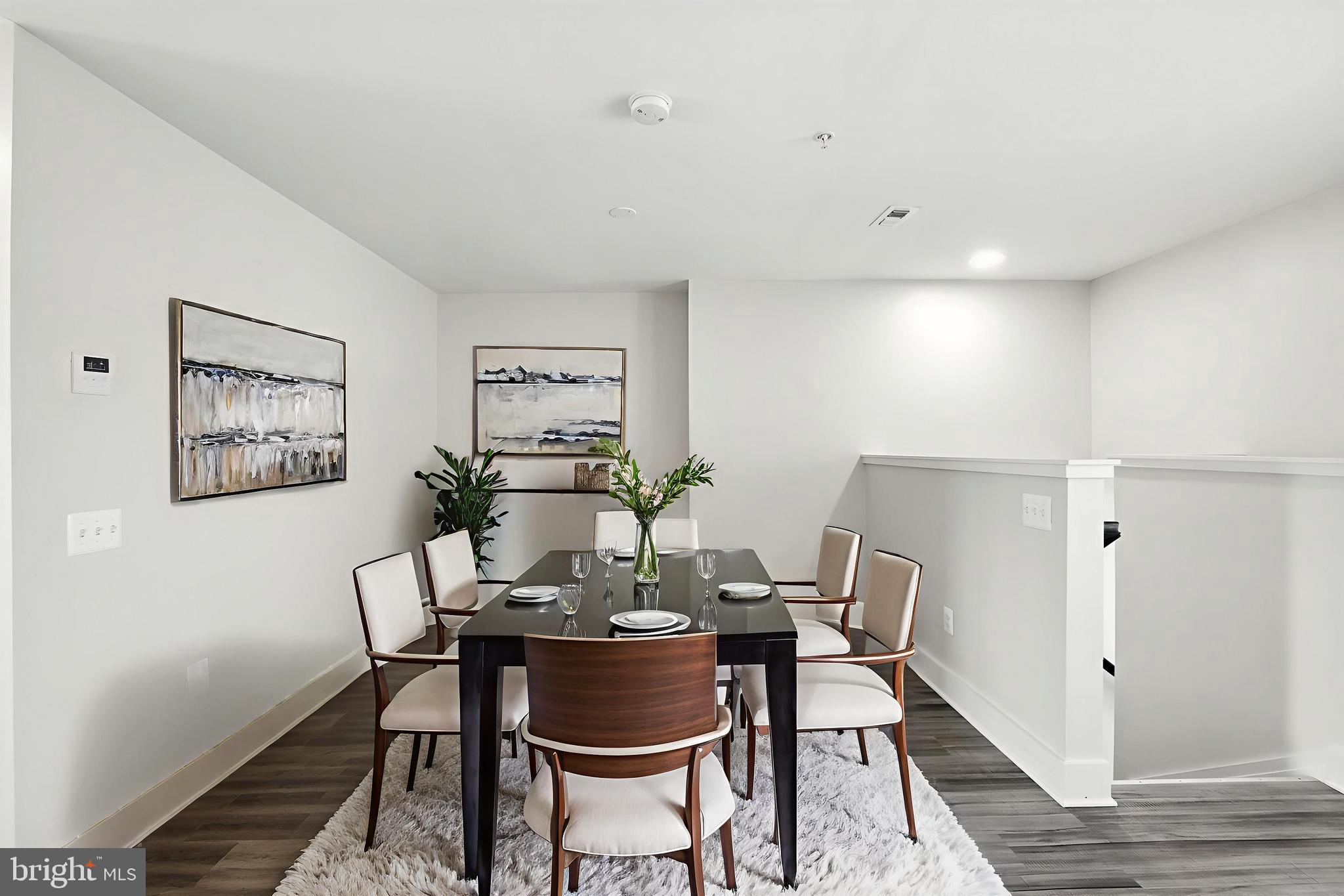 19510 Village Walk, Unit 2205 Montgomery Village, MD 20886 - Photo 10 of 21 a view of a dining room with furniture and wooden floor