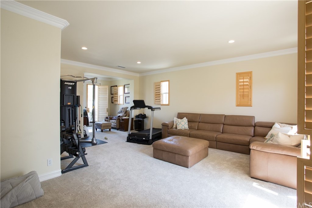 29 Marble Sands Newport Beach, CA 92660 - Photo 22 of 29 Bonus room near master features a balcony overlooking the back yard and a bathroom en suite.