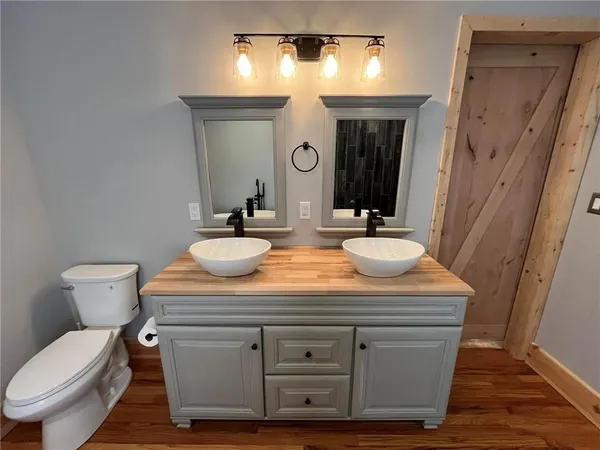a bathroom with a sink a mirror and a bathtub