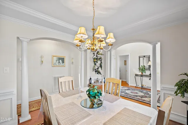 a view of a patio with a table and chairs