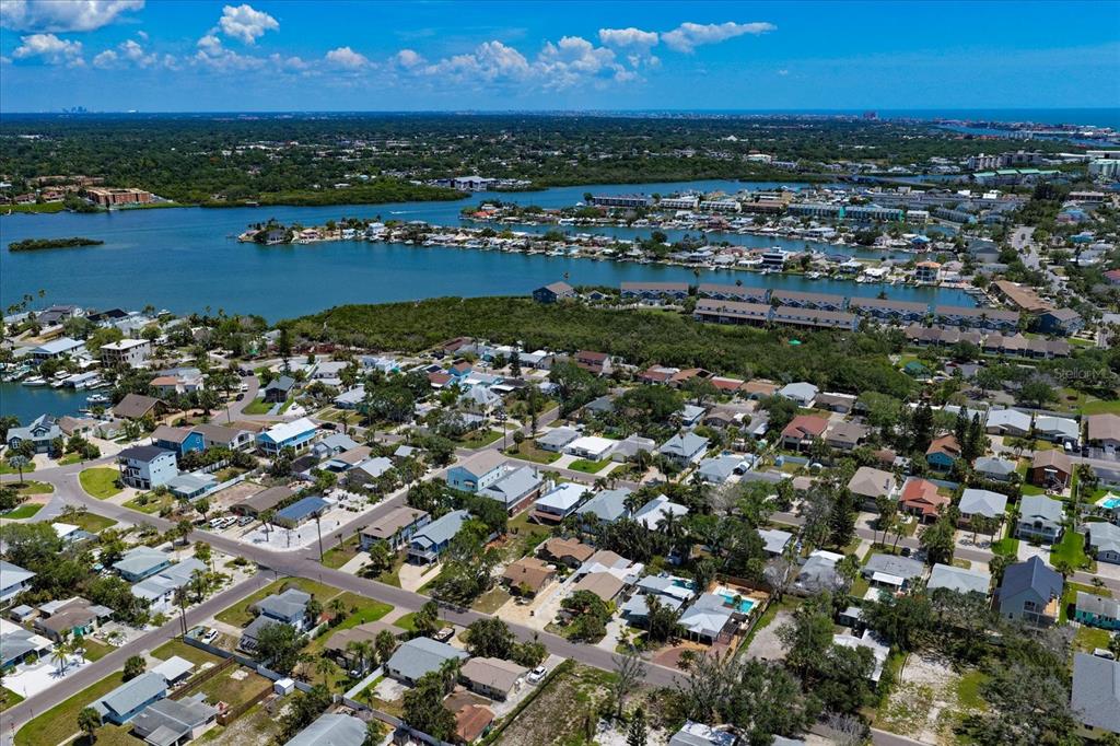 127 11th Avenue Indian Rocks Beach, FL 33785 - Photo 59 of 63 an aerial view of a city with lots of residential buildings ocean and ocean view
