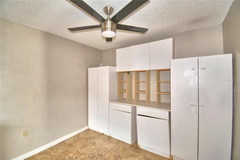 573 Hunter Circle Kissimmee, FL 34758 - Photo 16 of 36 a refrigerator freezer sitting inside of a kitchen
