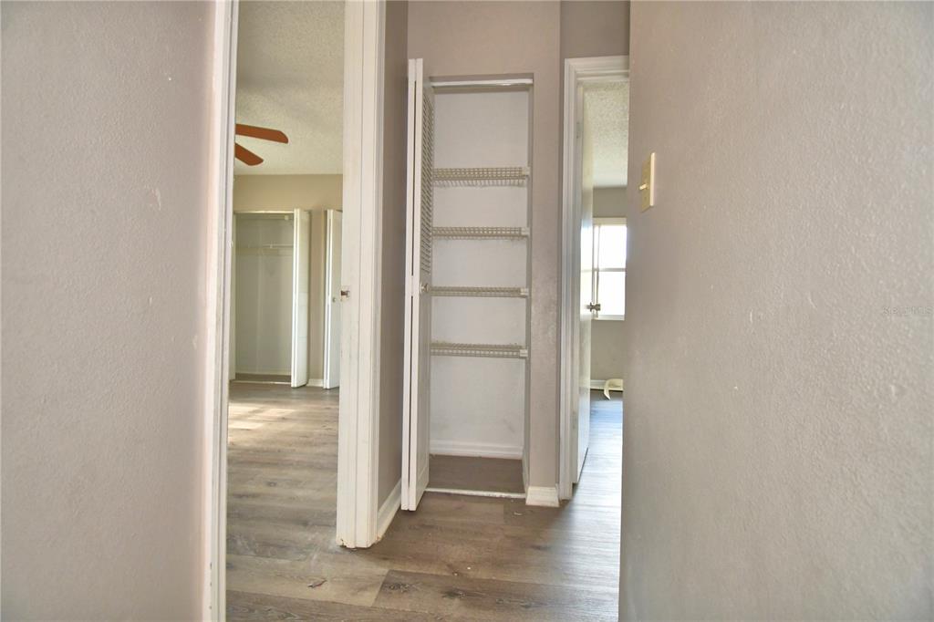 573 Hunter Circle Kissimmee, FL 34758 - Photo 18 of 36 an empty room with wooden door