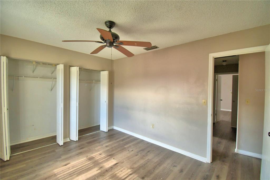 573 Hunter Circle Kissimmee, FL 34758 - Photo 28 of 36 wooden floor in an empty room