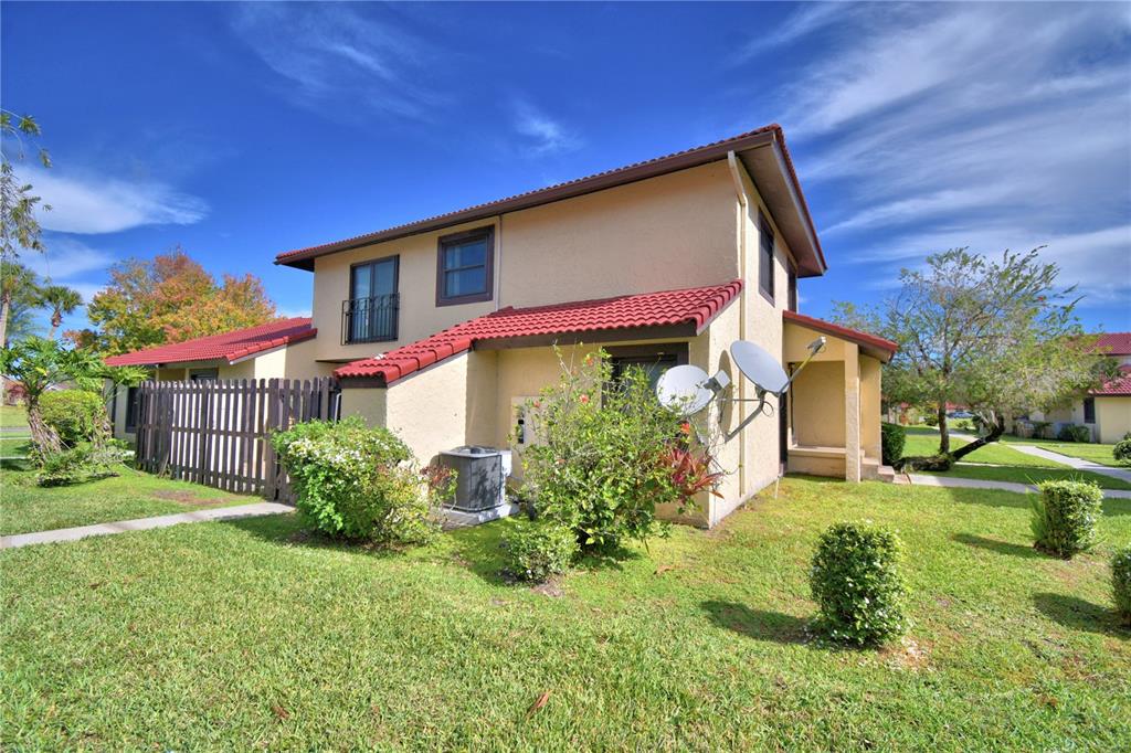 573 Hunter Circle Kissimmee, FL 34758 - Photo 3 of 36 a front view of a house with a yard