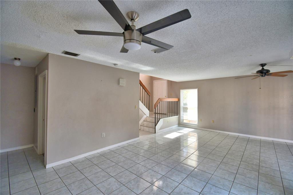 573 Hunter Circle Kissimmee, FL 34758 - Photo 10 of 36 a view of an empty room with a window