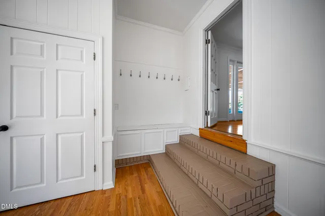 wooden floor with white walls