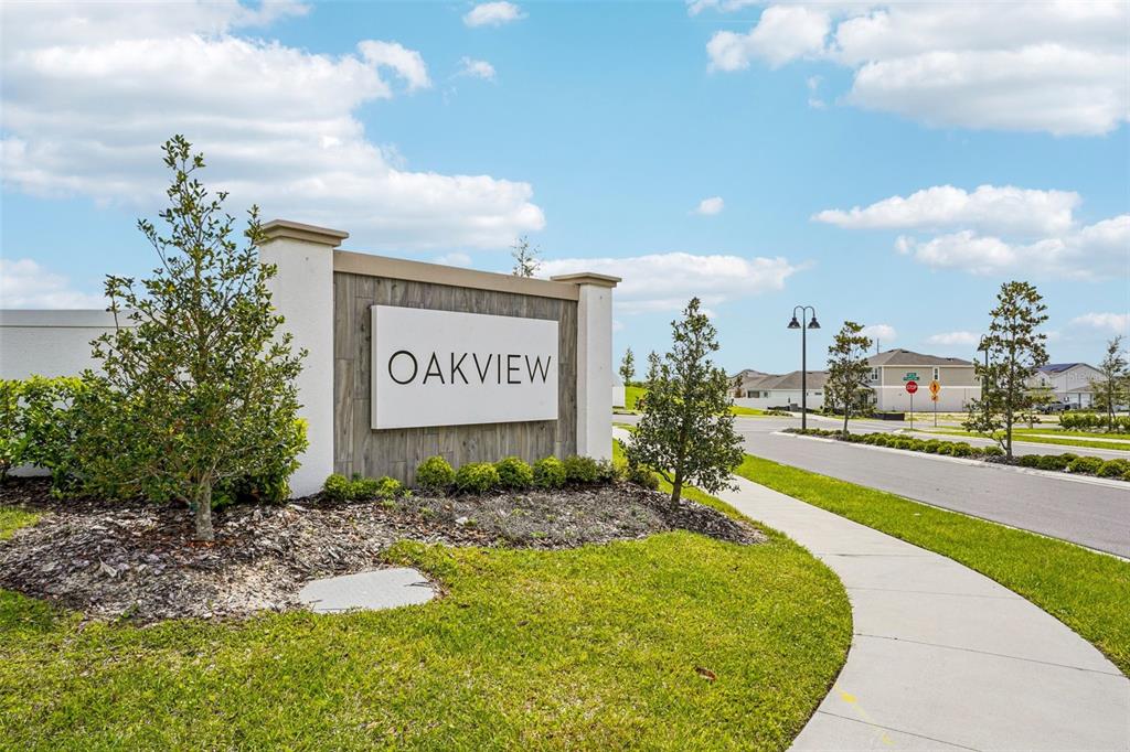 4771 Turkey Outlook Road Apopka, FL 32712 - Photo 2 of 2 a sign board with a play ground in the back