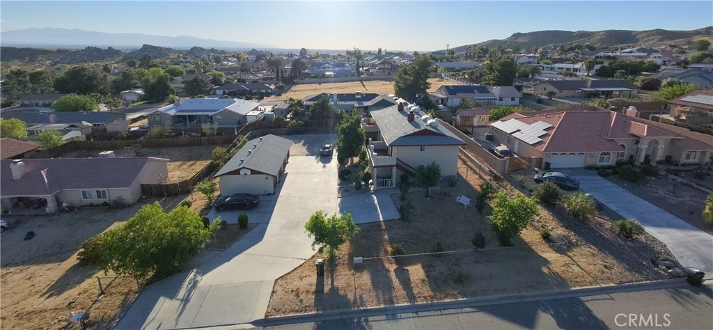 16228 Wato Road Apple Valley, CA 92307 - Photo 17 of 17 an aerial view of residential houses with outdoor space