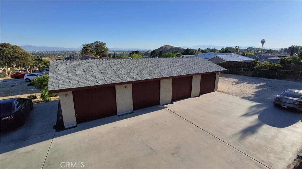 16228 Wato Road Apple Valley, CA 92307 - Photo 4 of 17 a terrace of a house with wooden floor and outdoor seating