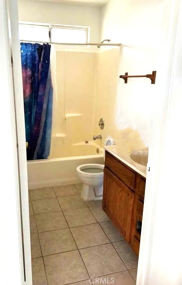 16228 Wato Road Apple Valley, CA 92307 - Photo 9 of 17 a bathroom with a toilet a sink and shower