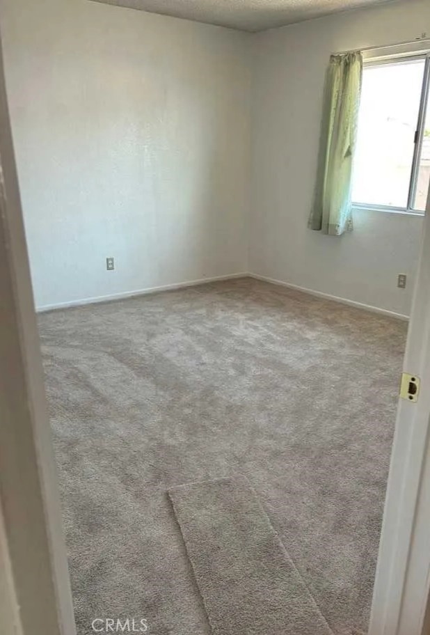 16228 Wato Road Apple Valley, CA 92307 - Photo 10 of 17 an empty room with windows