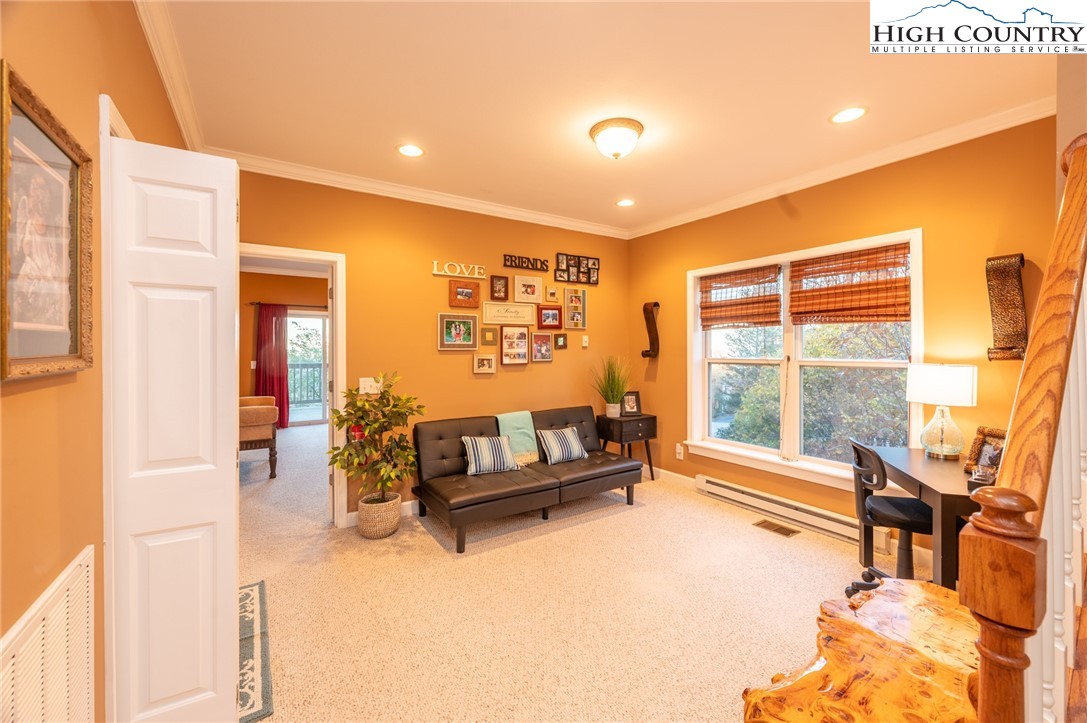 309 Pinnacle Ridge Road Beech Mountain, NC 28604 - Photo 20 of 45 a living room with furniture and a large window