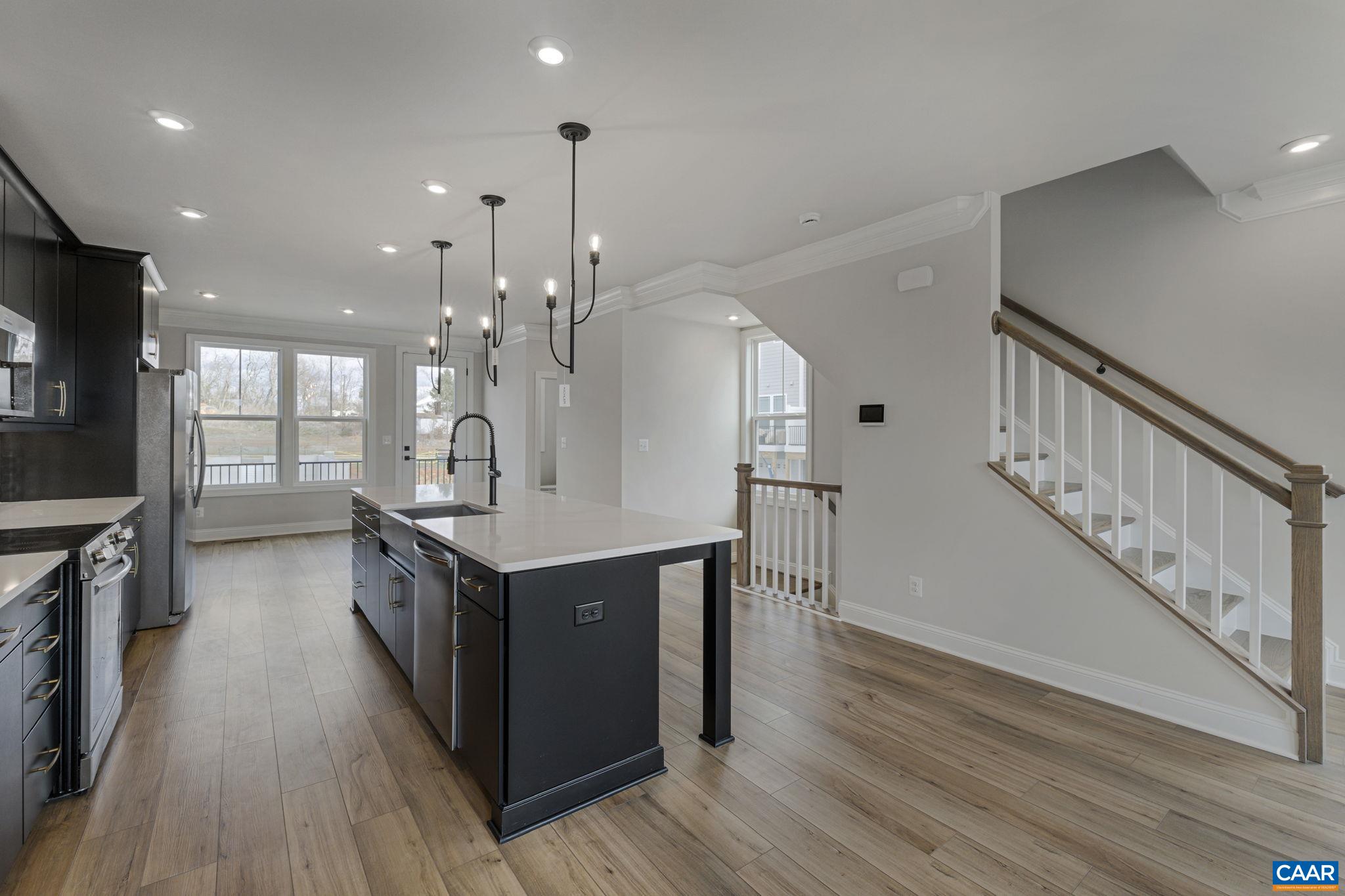138 Park Ridge Drive Crozet, VA 22932 - Photo 12 of 51 a kitchen with stainless steel appliances granite countertop a refrigerator a stove a sink and a wooden floors