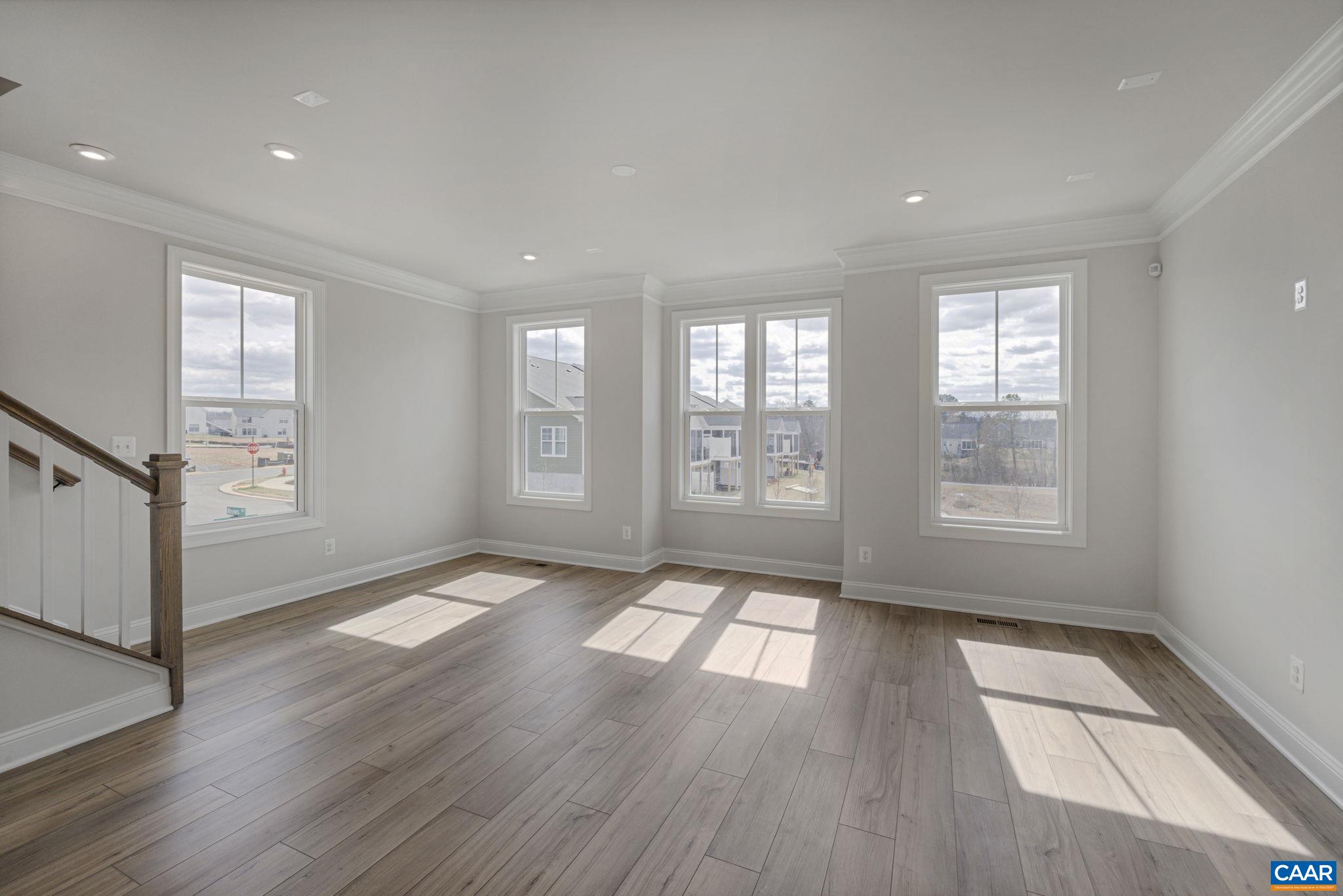 138 Park Ridge Drive Crozet, VA 22932 - Photo 21 of 51 a view of empty room with wooden floor and fan