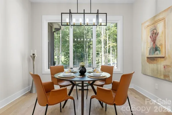 a dining room with furniture window and outside view