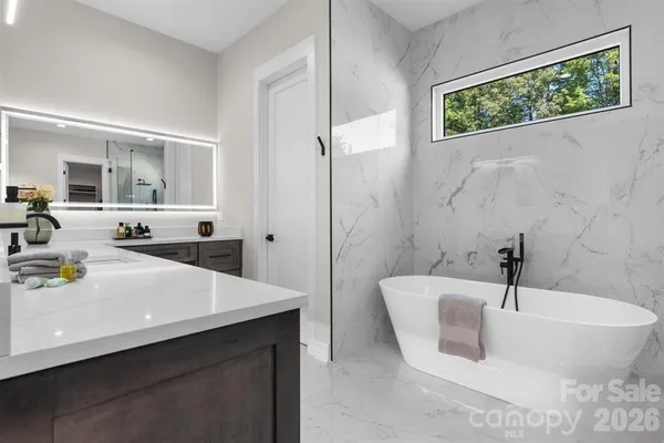 a bathroom with a bathtub and a sink