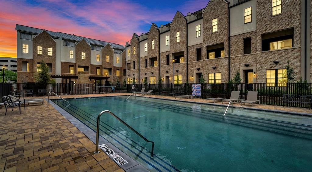 5421 Patterson Street Irving, TX 75039 - Photo 1 of 32 Expansive outdoor swimming pool with integrated entry steps and handrails, complemented by a paver deck