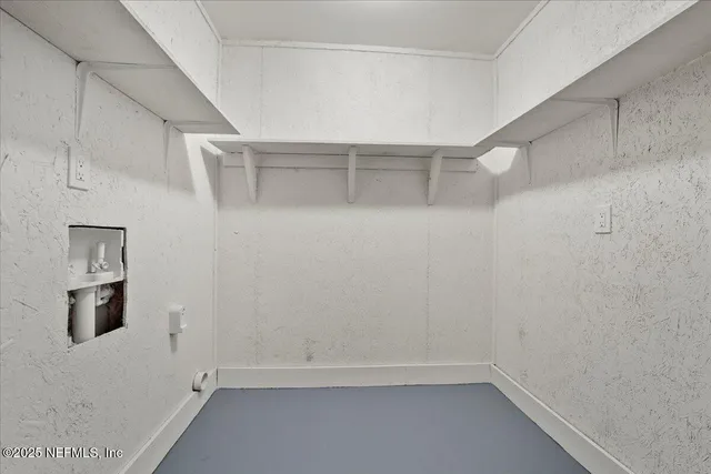 a view of an empty walk in closet