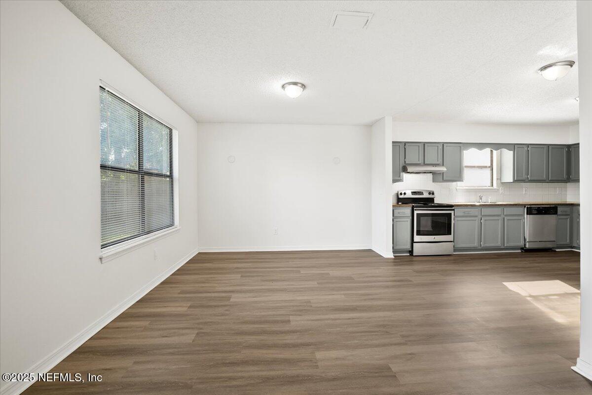 8215 Sailmaker Lane Jacksonville, FL 32210 - Photo 5 of 29 a view of kitchen with wooden floor