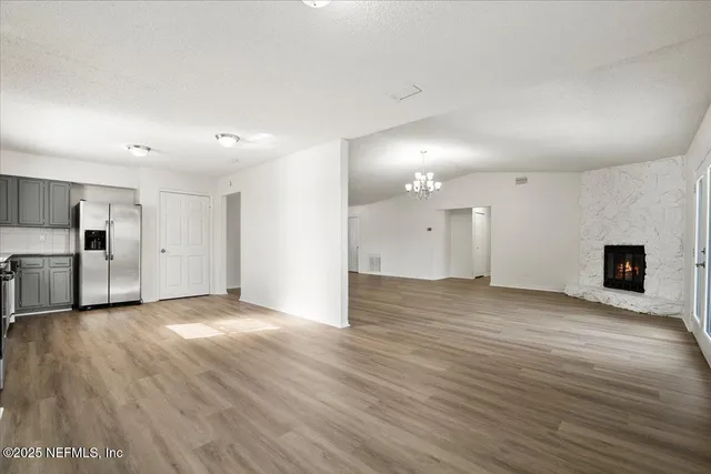 a view of a big room with wooden floors