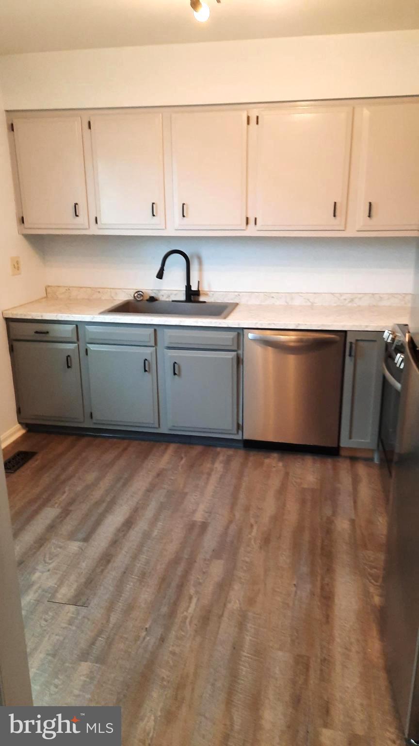 702 Allenview Drive Mechanicsburg, PA 17055 - Photo 3 of 17 a kitchen with granite countertop white cabinets and stainless steel appliances