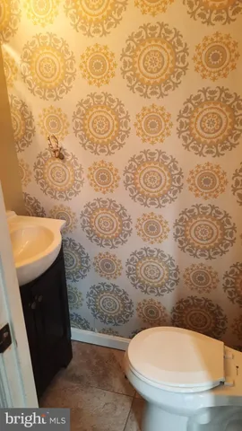 a bathroom with a toilet and a sink