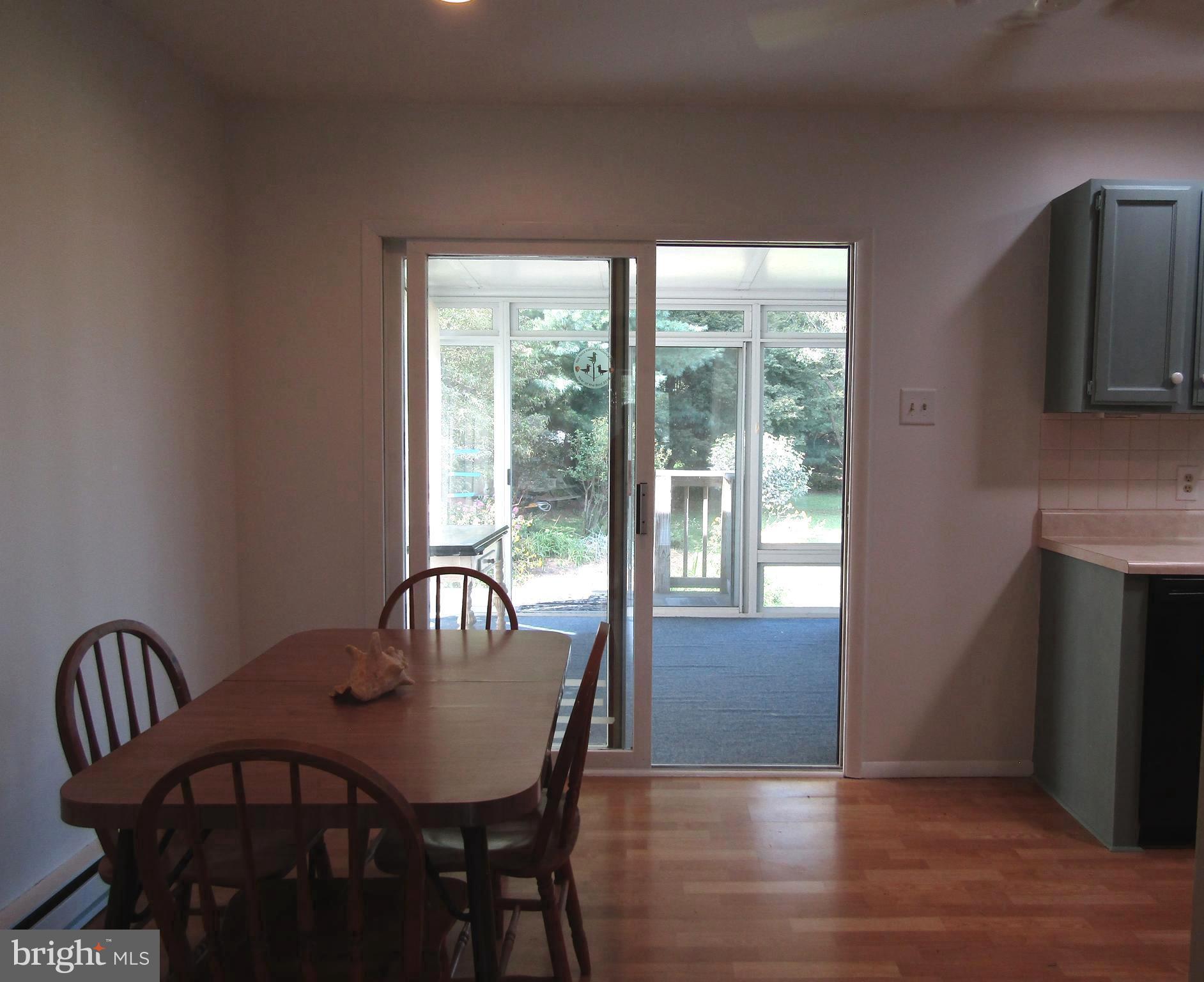 2 Reds Lane West Grove, PA 19390 - Photo 5 of 32 Dining area looking into sunroom with yard beyond