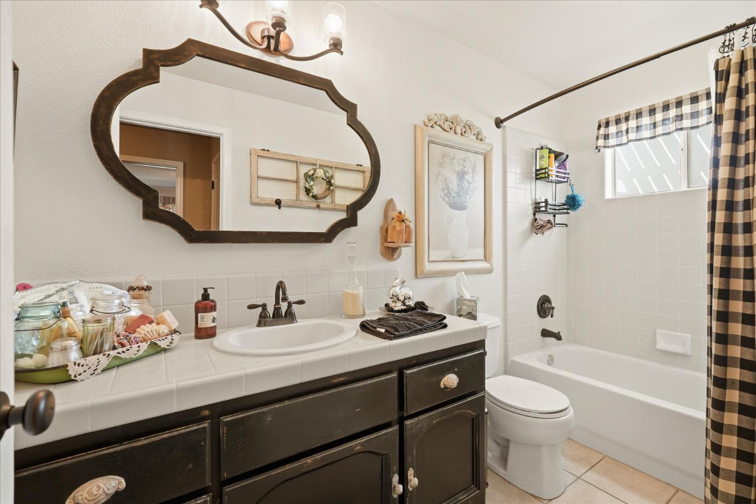 32583 River Knolls Road Coarsegold, CA 93614 - Photo 36 of 63 a bathroom with a sink a toilet and a mirror