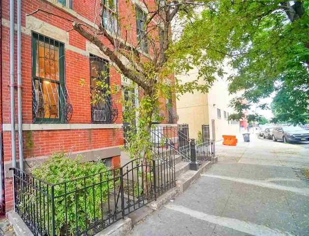 a street view with tall buildings and a street view