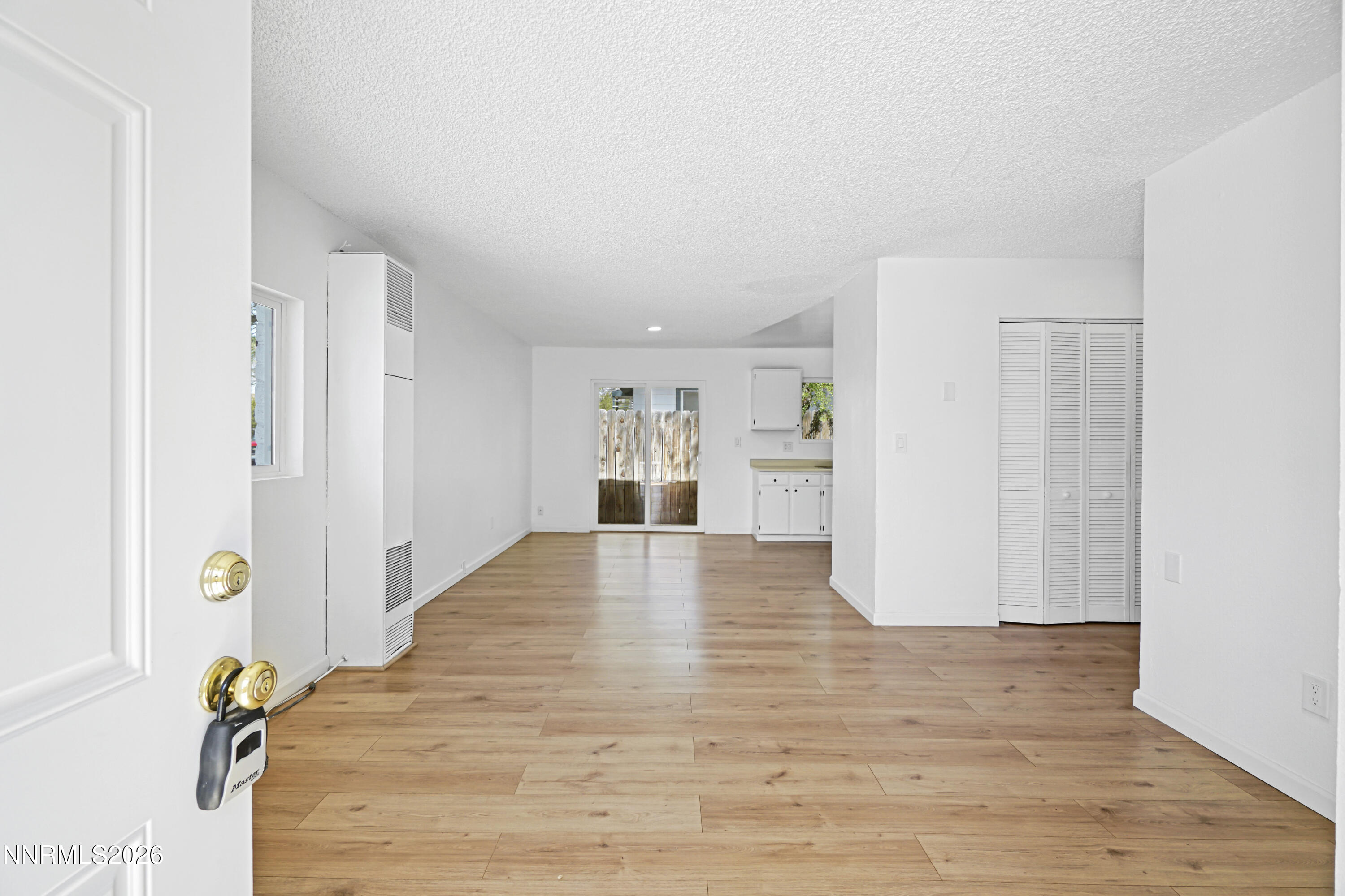 535 Churchill Street Fallon, NV 89406 - Photo 2 of 19 a view of empty room with wooden floor