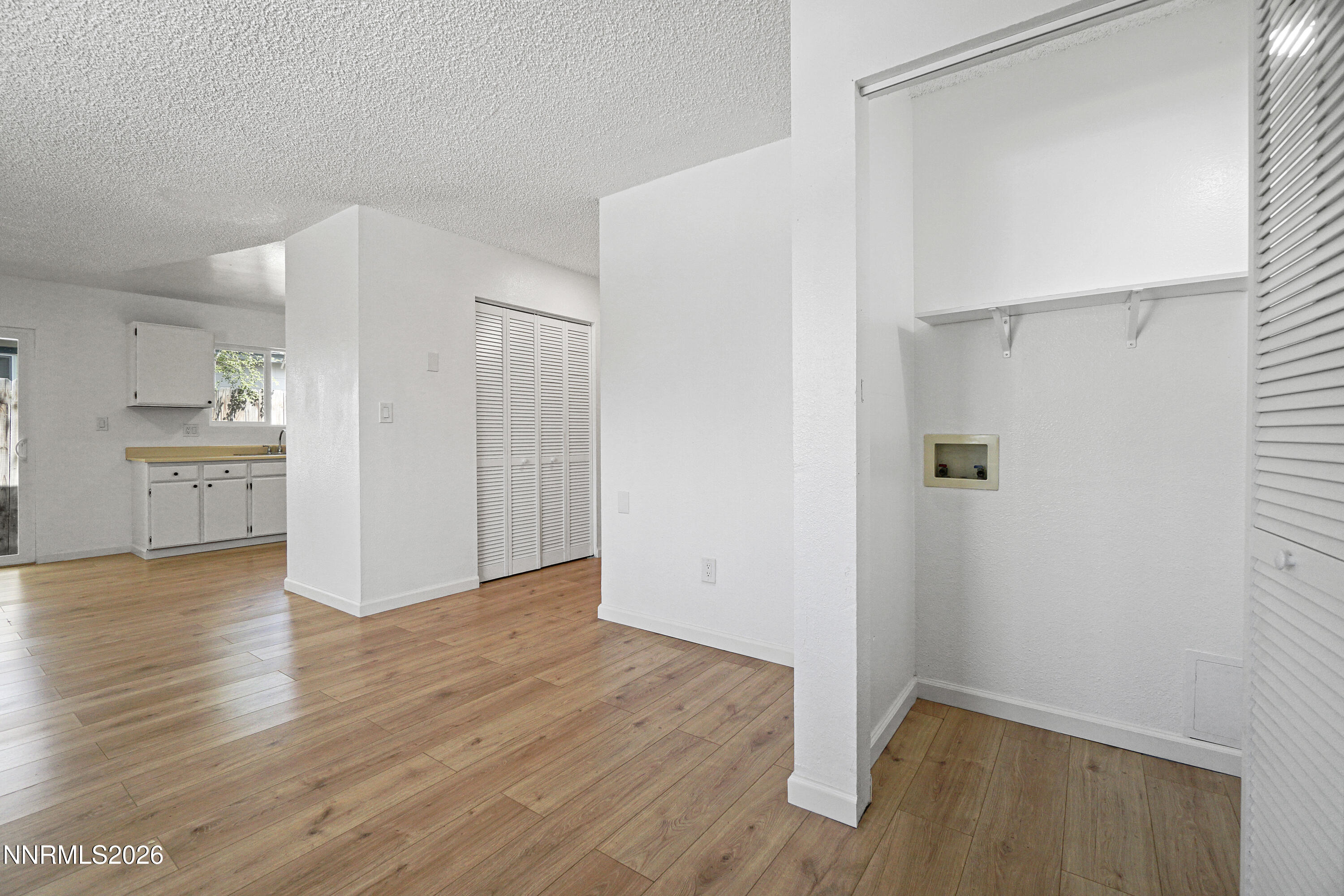 535 Churchill Street Fallon, NV 89406 - Photo 9 of 19 a view of a kitchen with wooden floor and a sink