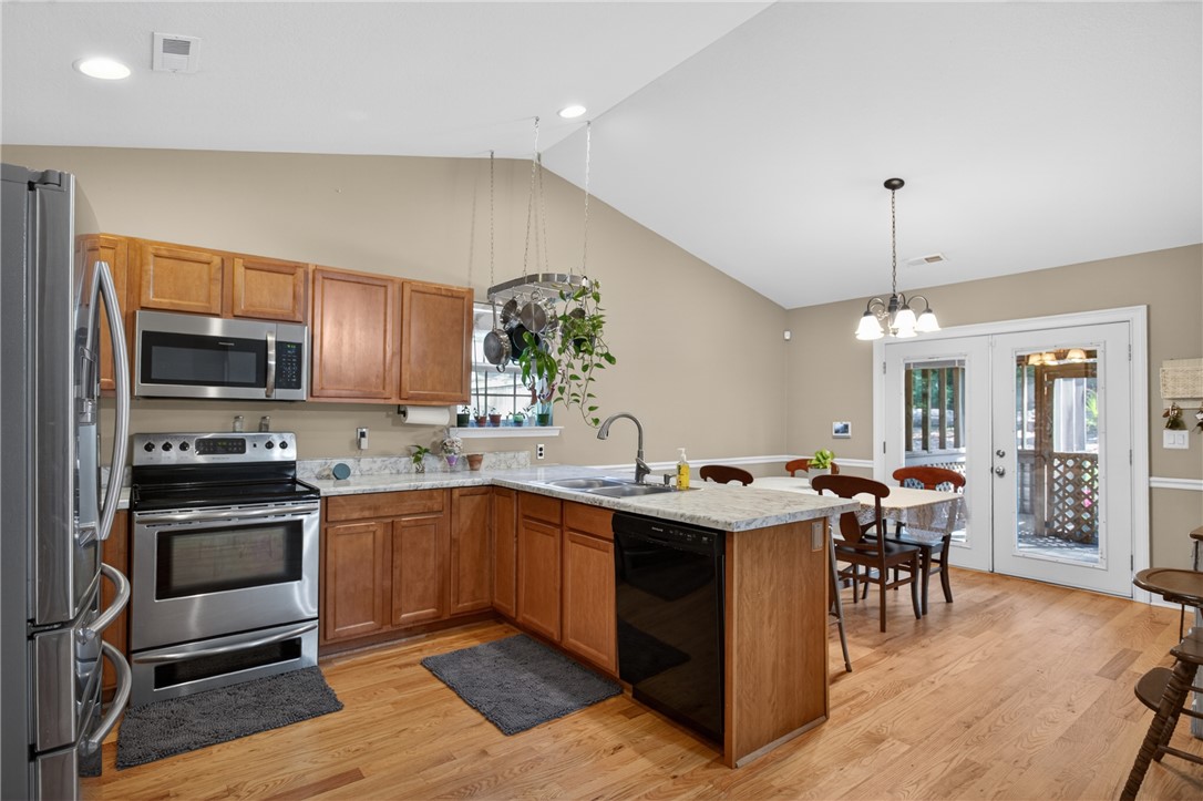 151 Towne Creek Trail Anderson, SC 29621 - Photo 11 of 49 Culinary adventures await in this naturally illuminated kitchen, featuring a practical island with seating and deck access.