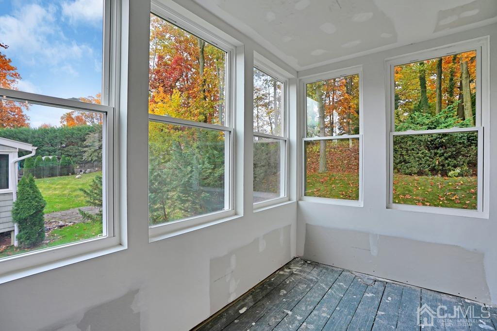 41 Merker Drive Edison, NJ 08837 - Photo 34 of 35 Sun porch off dining room - In progress. All new windows. Flooring and paint to be completed.