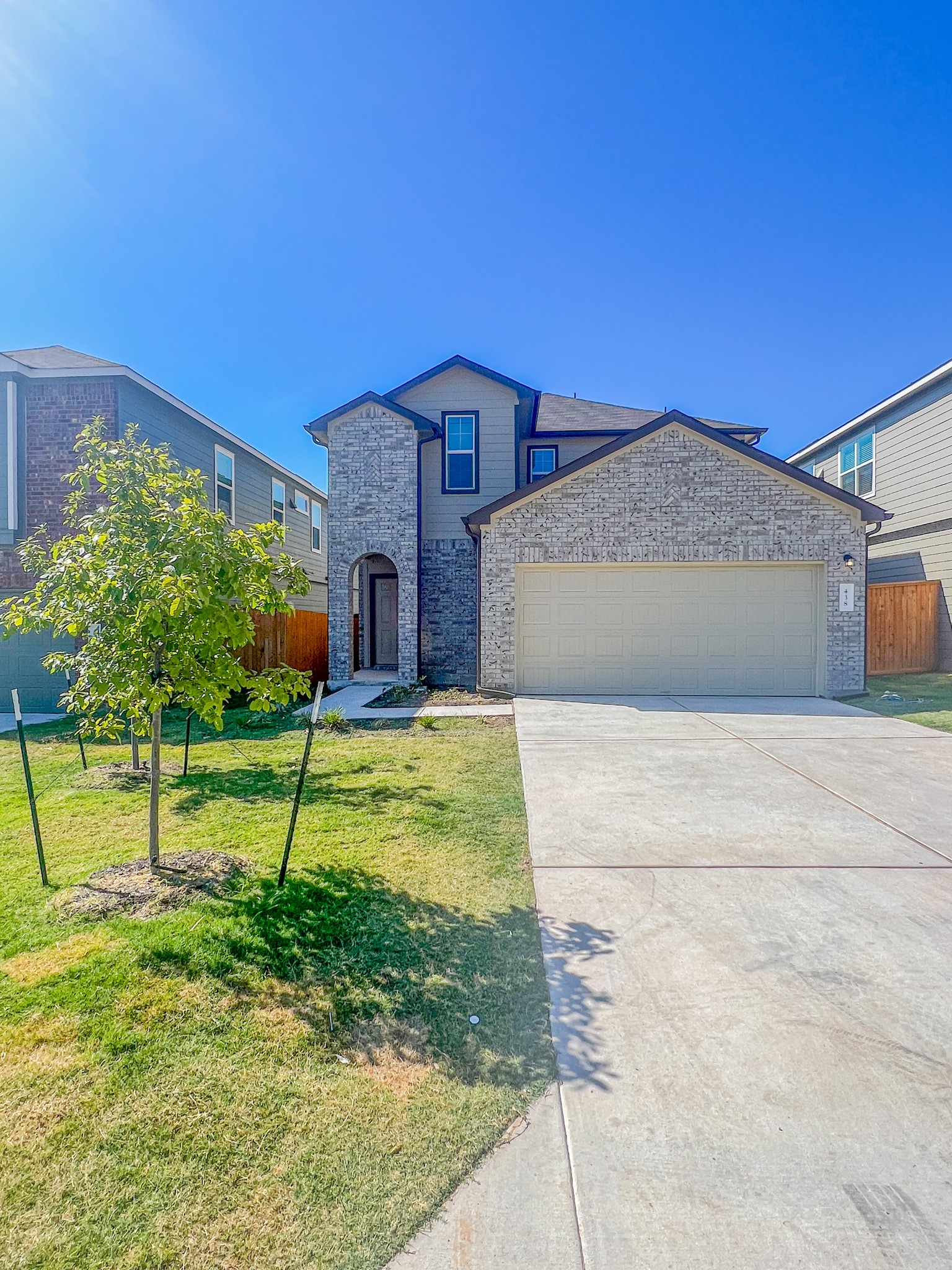 438 Perfect World Loop Jarrell, TX 76537 - Photo 1 of 35 a front view of a house with garden