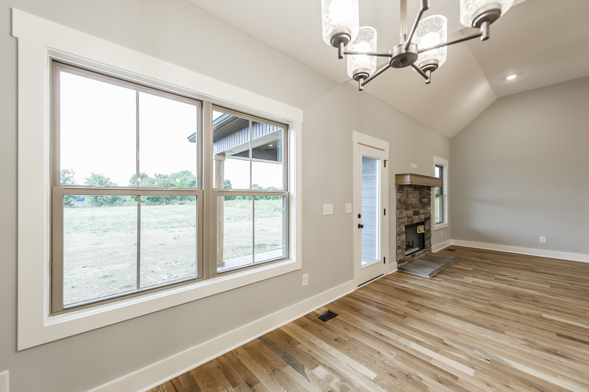 511 Clearview Road Cottontown, TN 37048 - Photo 13 of 41 a view of an empty room with a window and hardwood floor