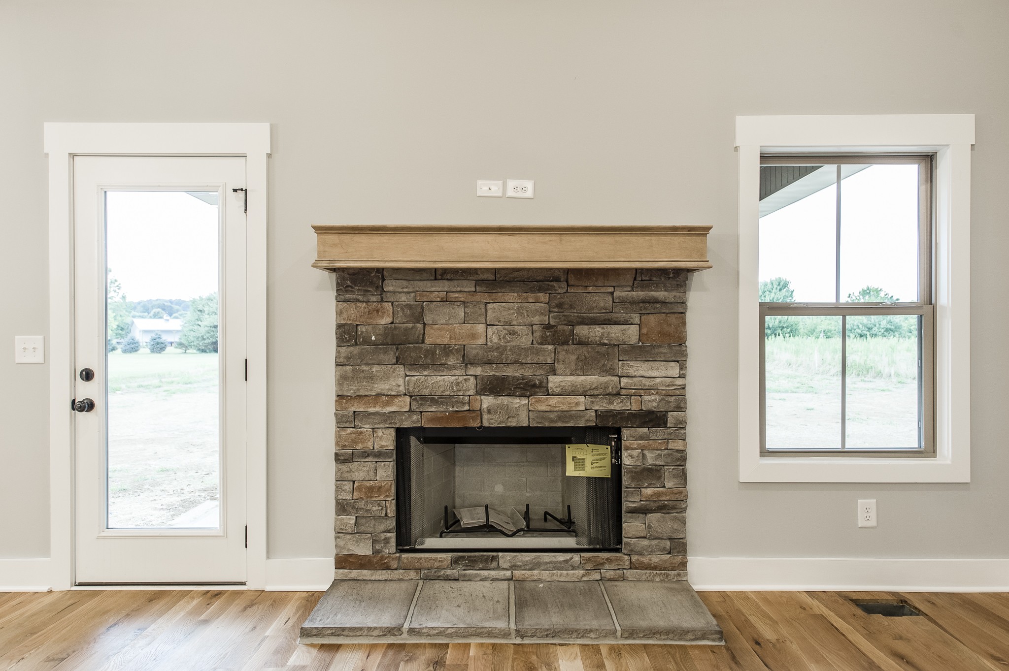 511 Clearview Road Cottontown, TN 37048 - Photo 10 of 41 an empty room with fireplace and windows