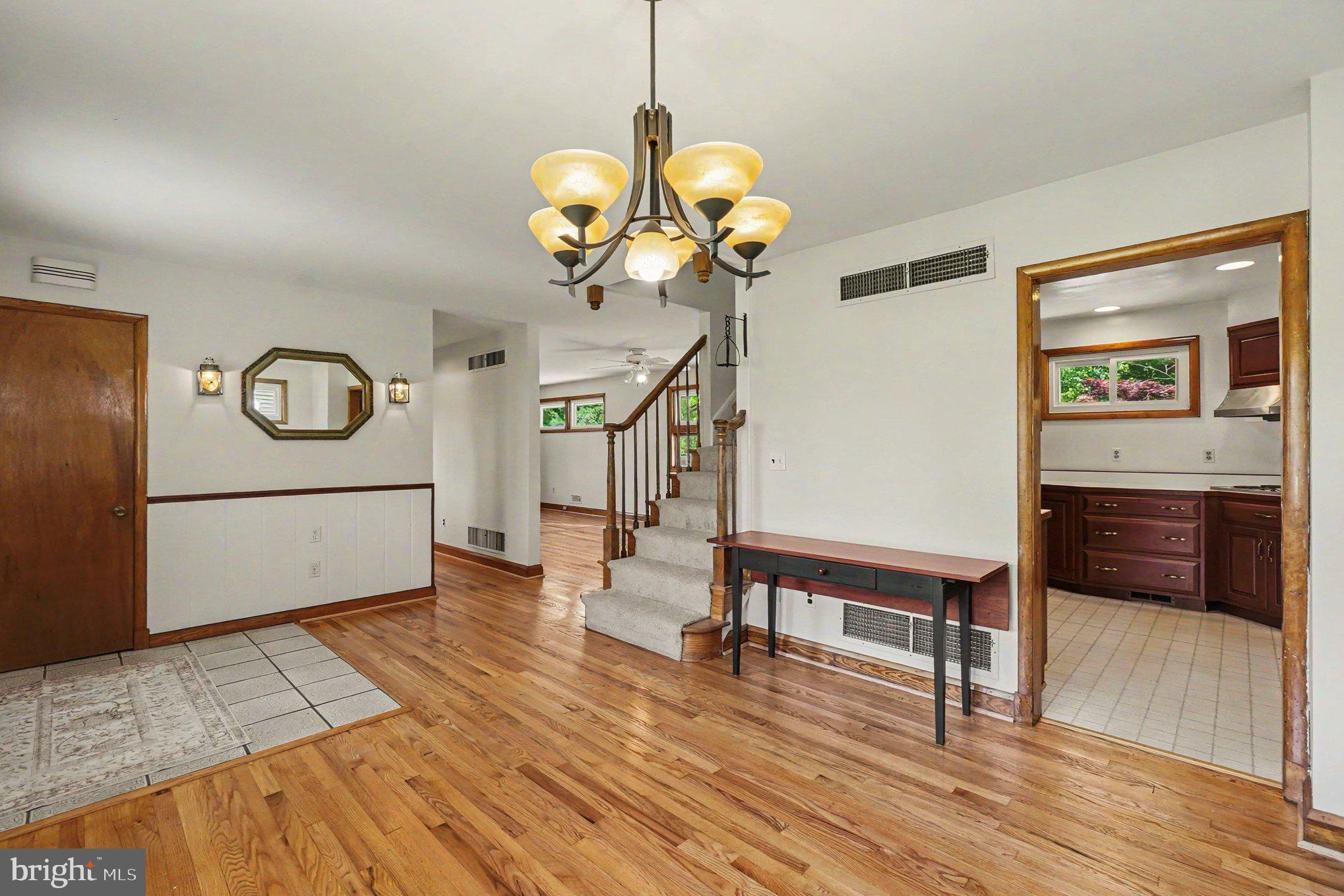9204 Snyder Lane Perry Hall, MD 21128 - Photo 8 of 42 a view of a livingroom with furniture wooden floor and a ceiling fan