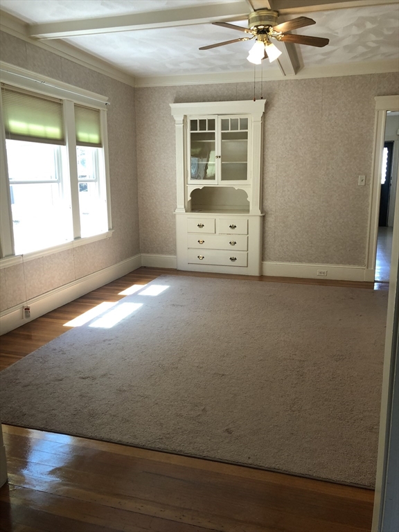 64 Freeman Street, Unit 1 Arlington, MA 02474 - Photo 3 of 9 a view of an empty room with a window
